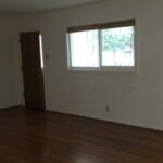 A completely empty living room, when leaving the house for the last time